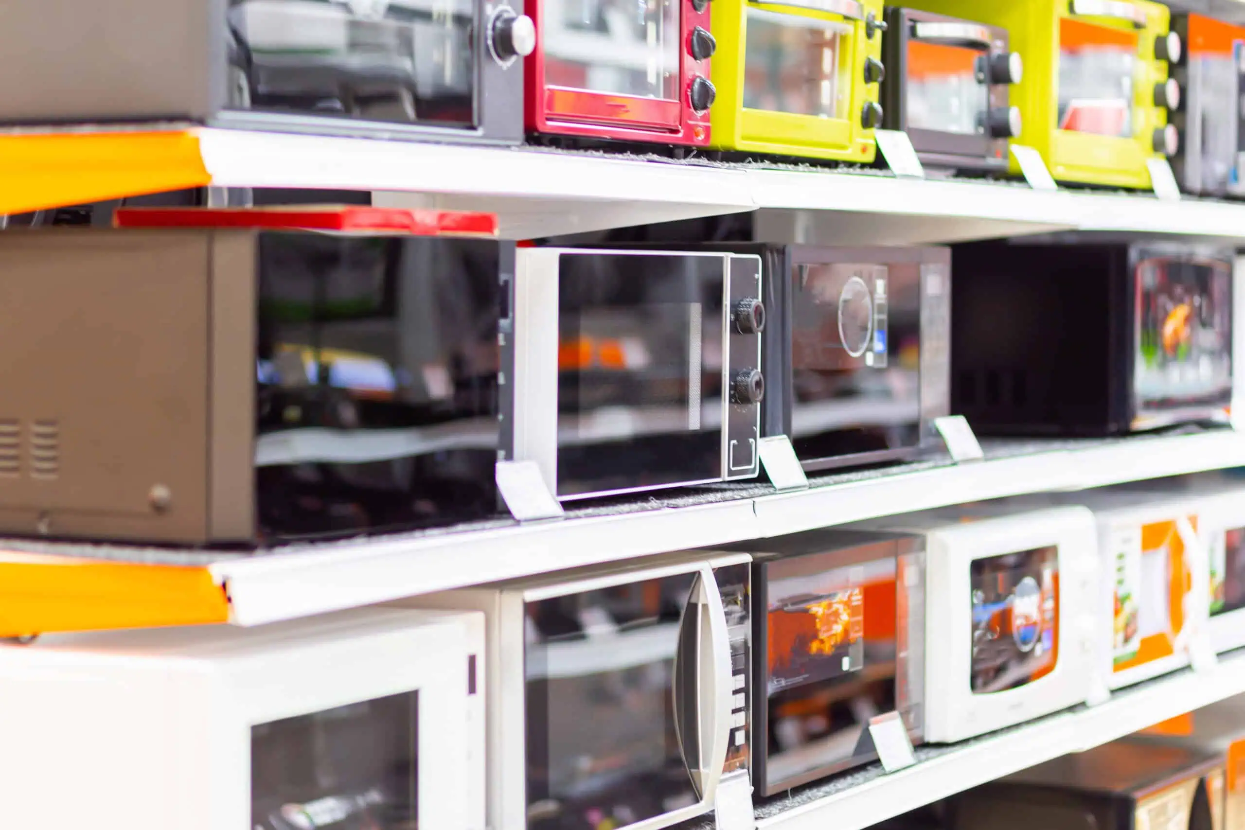 microwave ovens stand row shelves supermarket scaled